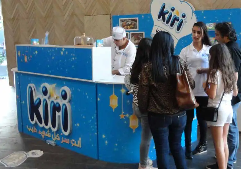 Kiri in-store kitchen counter with a chef serving shoppers