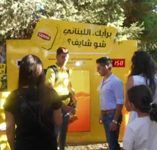 Lipton booth with promoters talking to passers-by