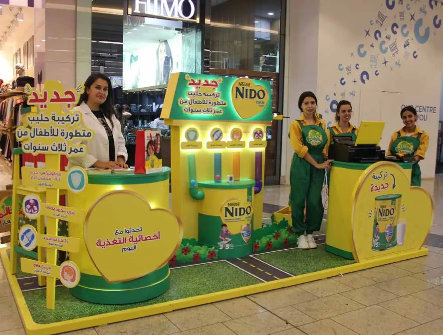 Nido stand with promoters inside a shopping mall